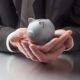 Man Holding Piggy Bank Image